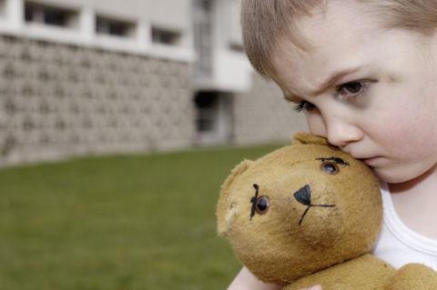 abused child with teddy bear